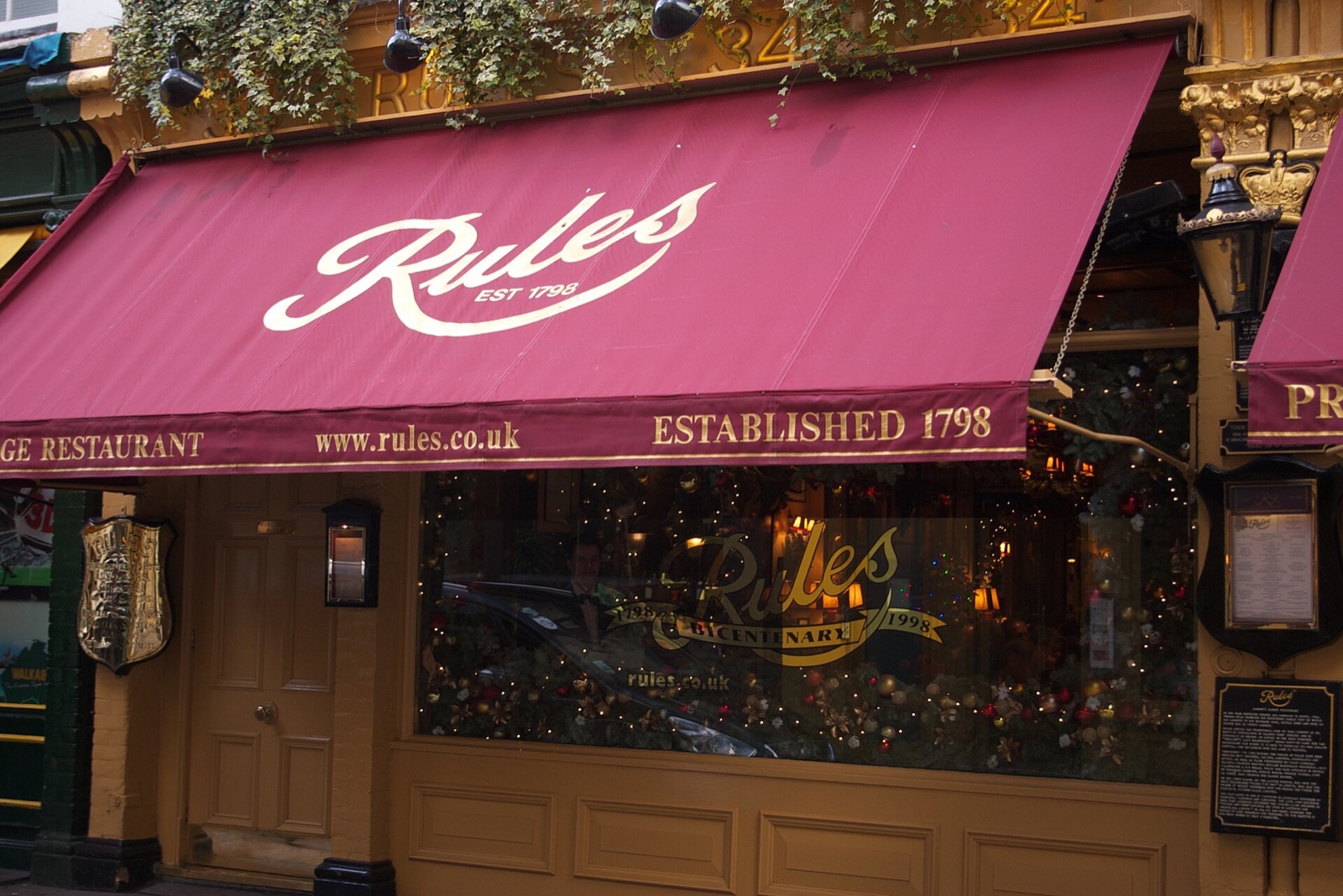 The red awning of Rules, with the name of the restaurant and the year 1798.