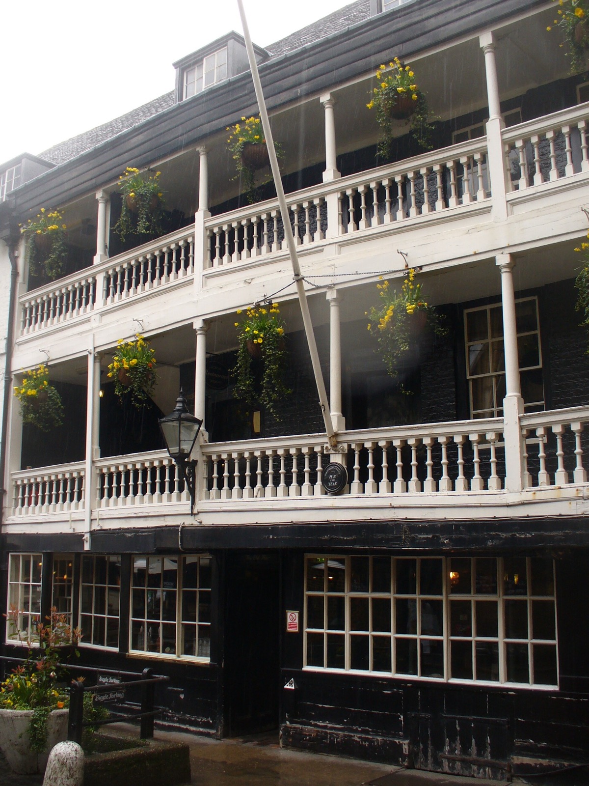 The white wooden galleries of the George Inn, one above the other.