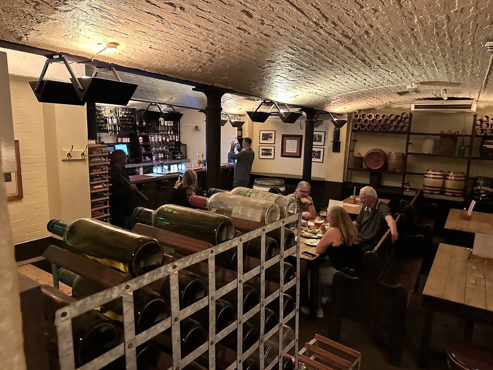 A cellar bar of Ye Olde Cheshire Cheese, under a low vaulted ceiling.