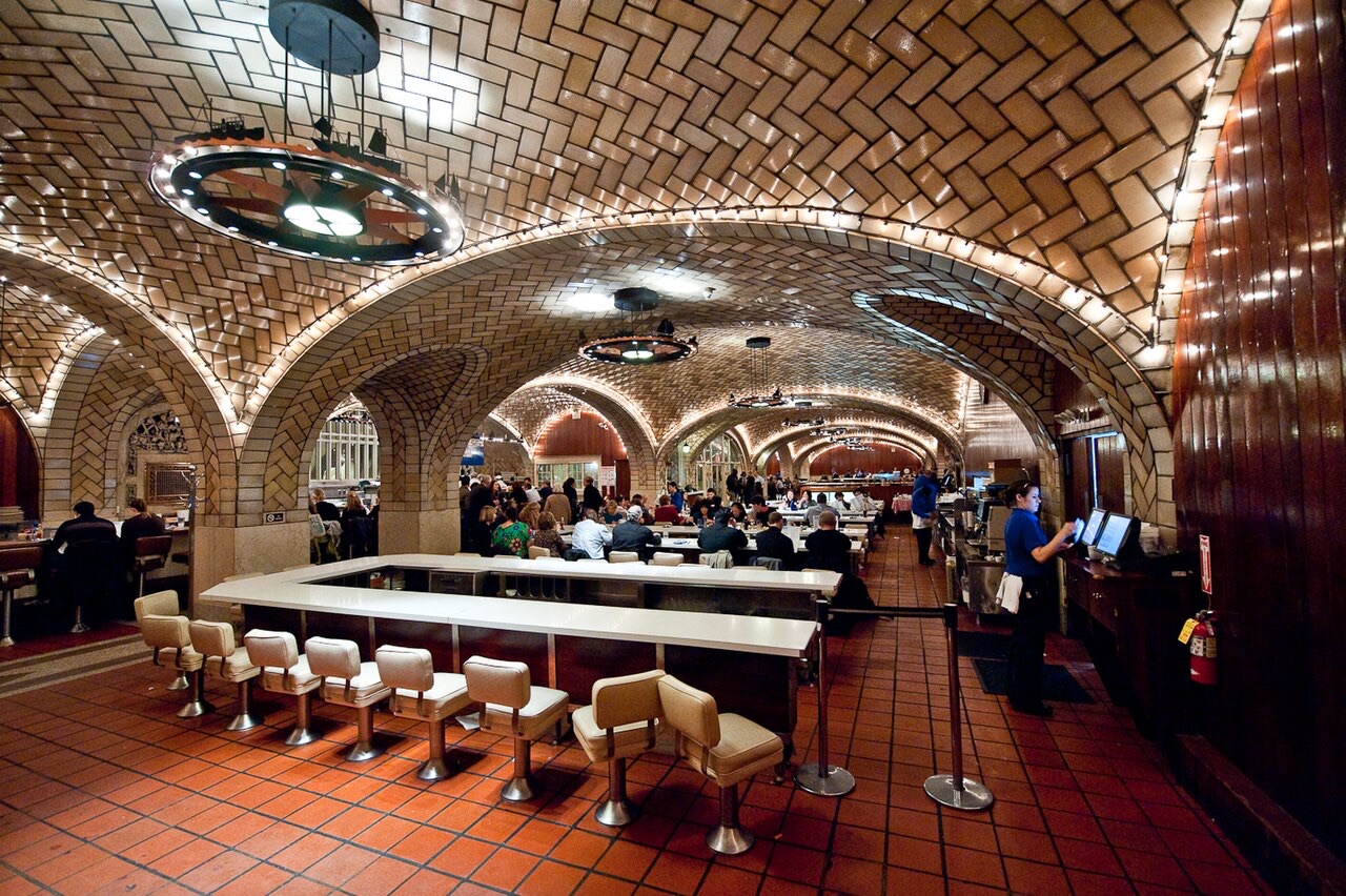 The white counters and stools of the Grand Central Oyster Bar.