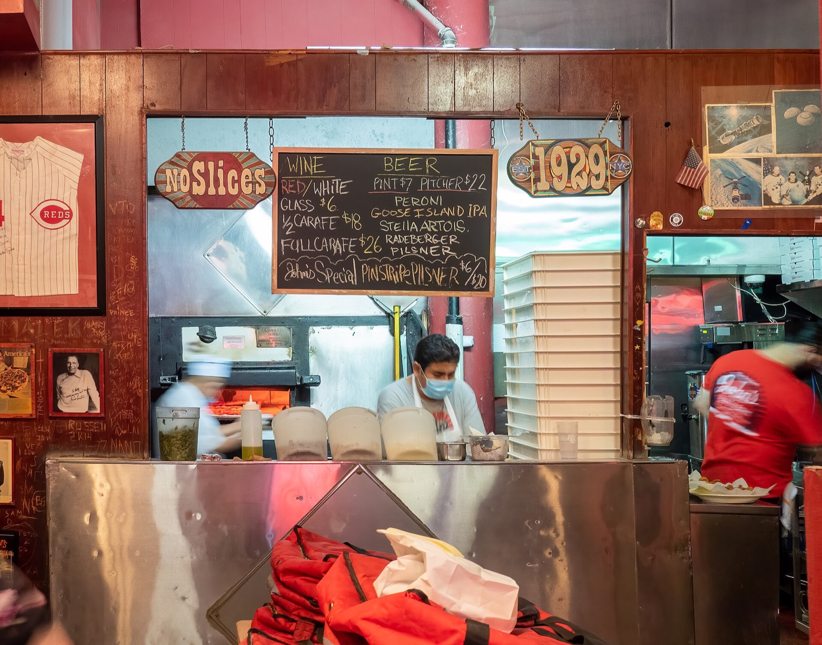 The kitchen at John's of Bleecker Street, with the cooks at the brick oven.