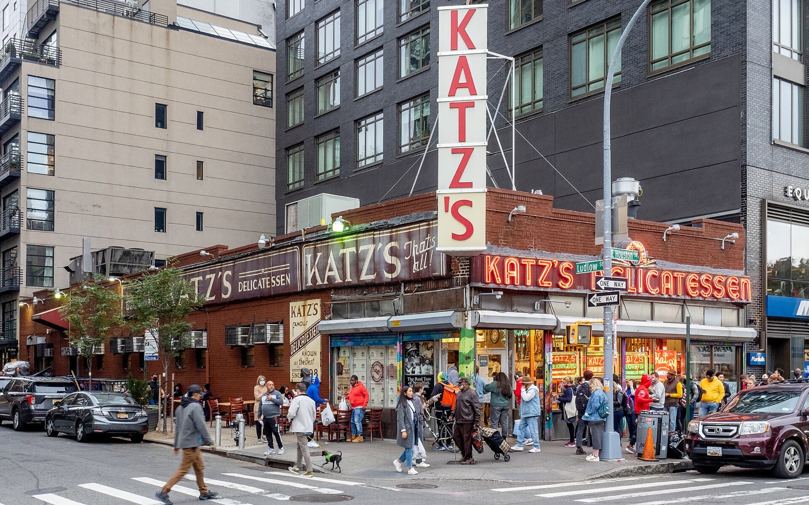 Katz's Delicatessen on the corner of East Houston Street, with its vertical red sign.