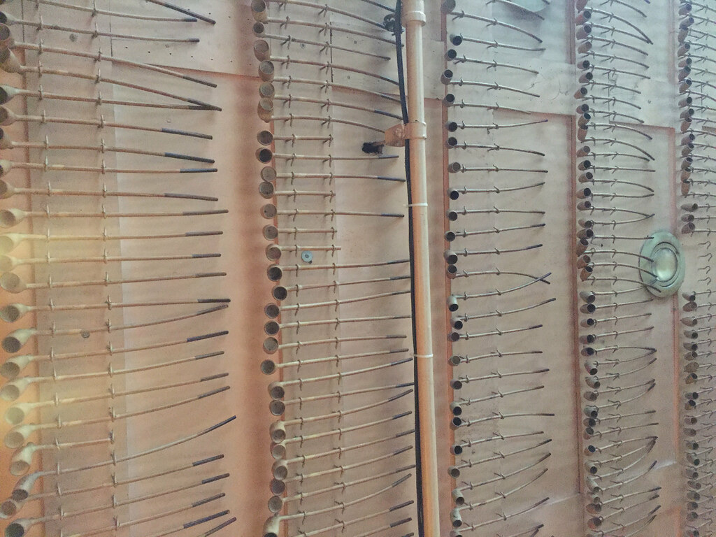Rows of long clay pipes hanging from the ceiling at Keens Steakhouse.