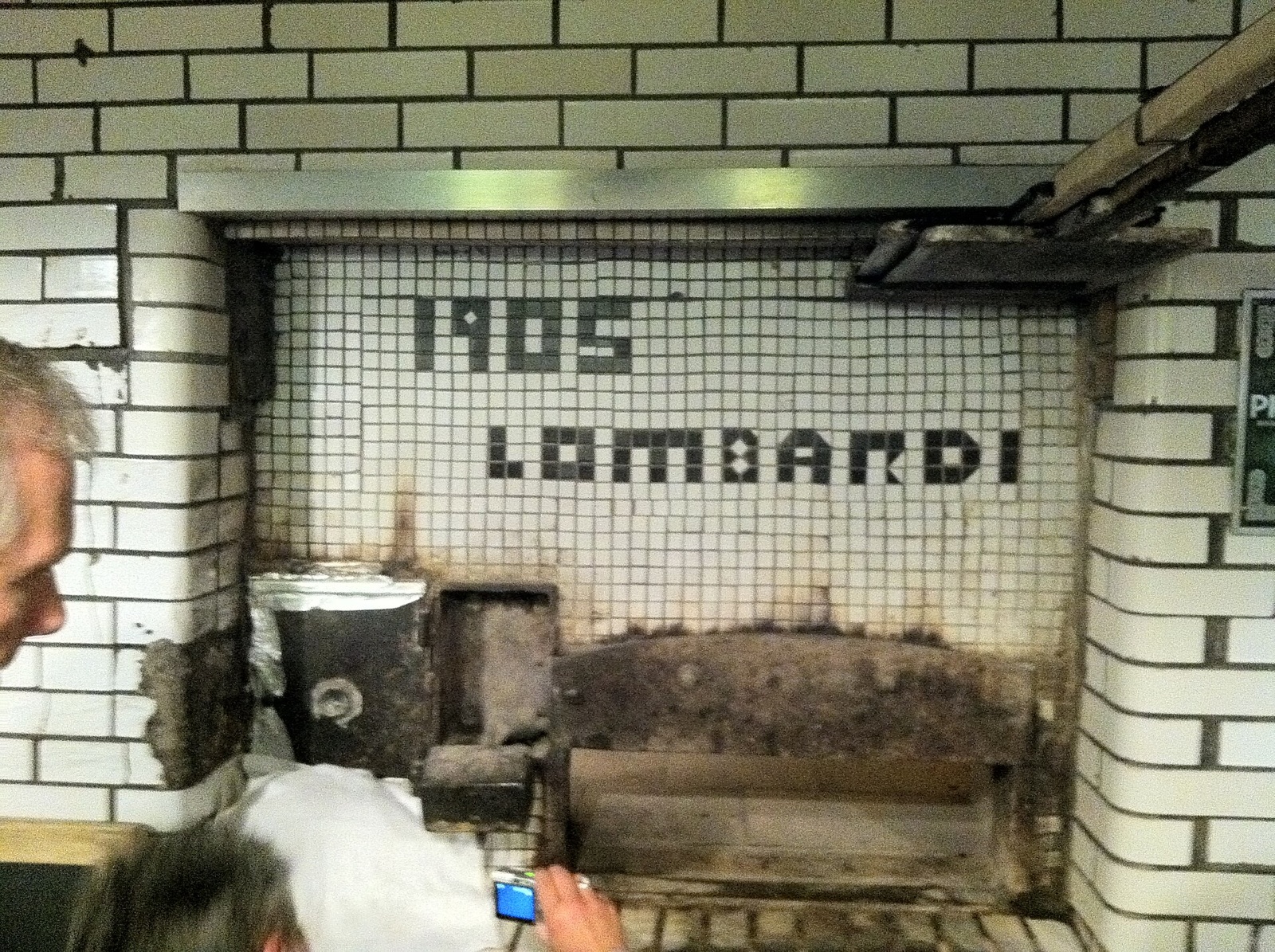The coal oven at Lombardi's, with the year 1905 set in tiles above its mouth.