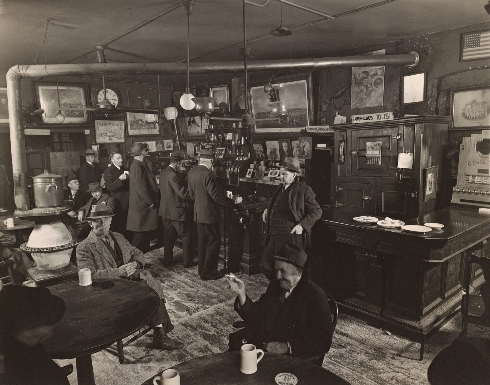 Men drinking round the stove at McSorley's in the 1930s, in a photograph of the time.