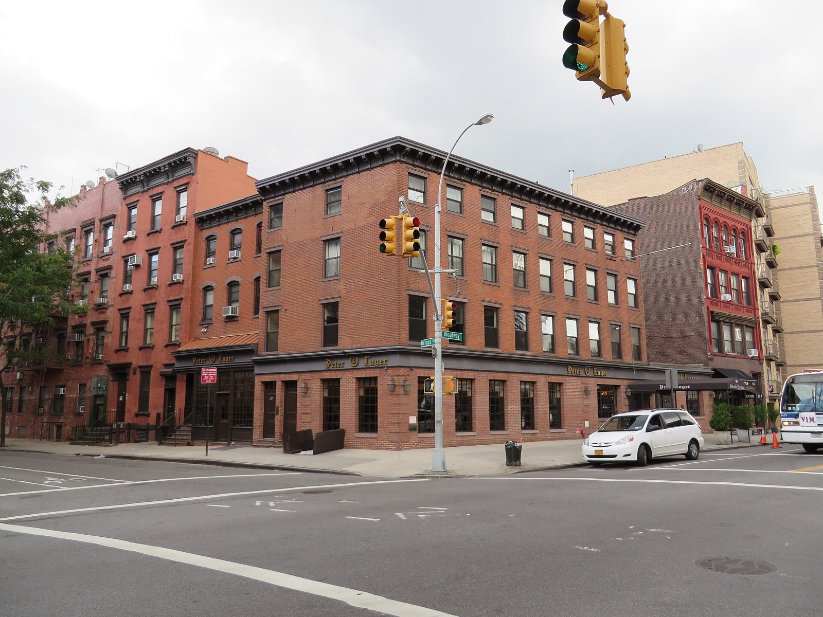 Peter Luger Steak House, a brick building on the corner of Broadway in Williamsburg.