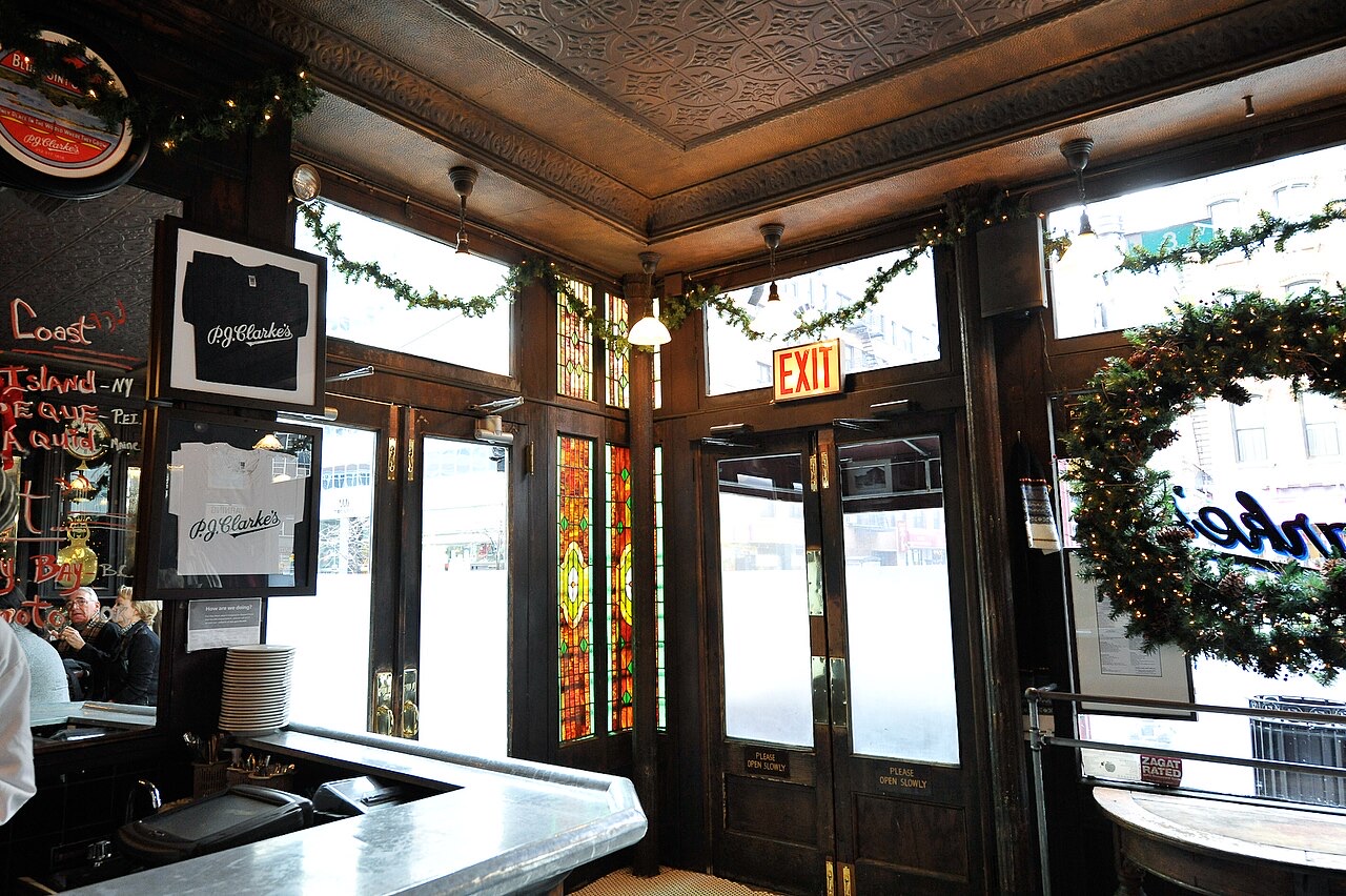 The old windows and woodwork of the saloon at P.J. Clarke's, seen from inside.