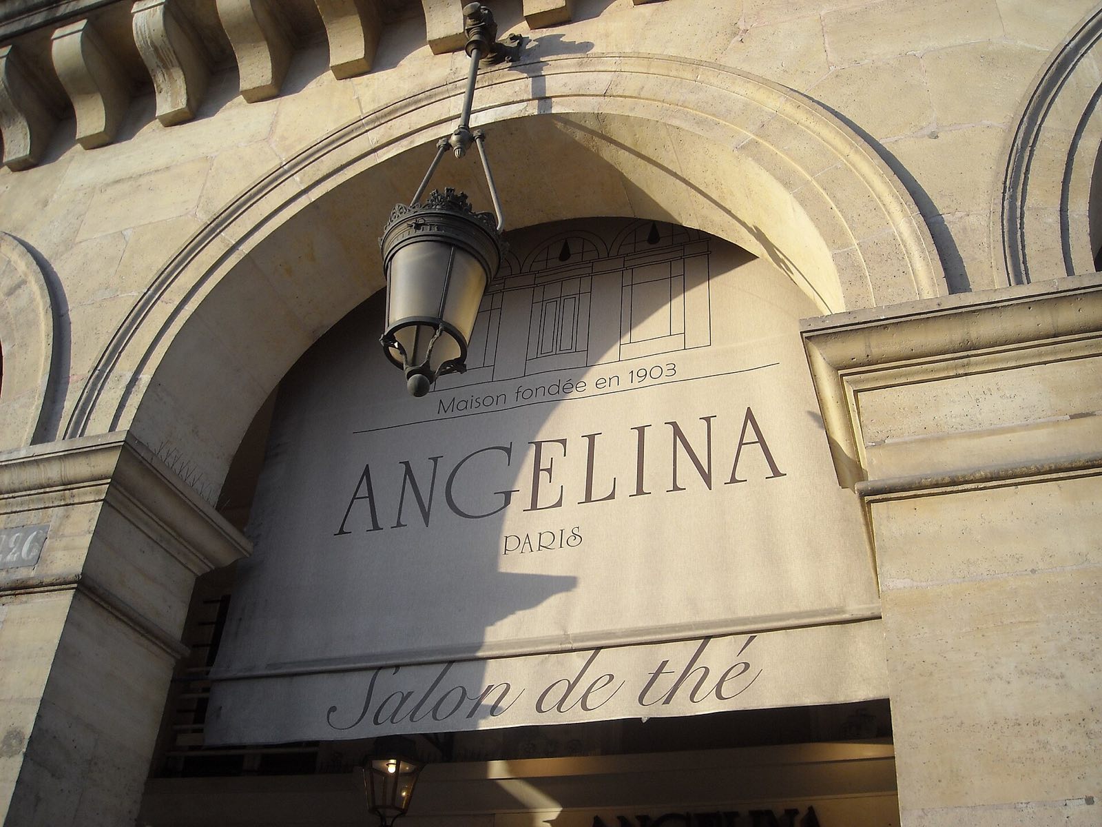 The name Angelina over the arched entrance of the tea room on the rue de Rivoli.