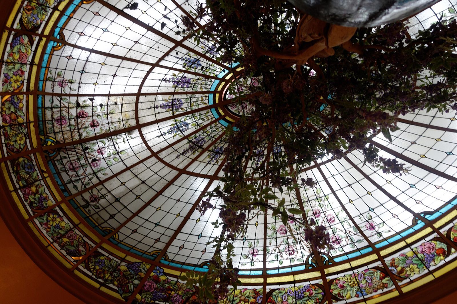 The stained-glass dome over the main room of Bofinger, seen from below.