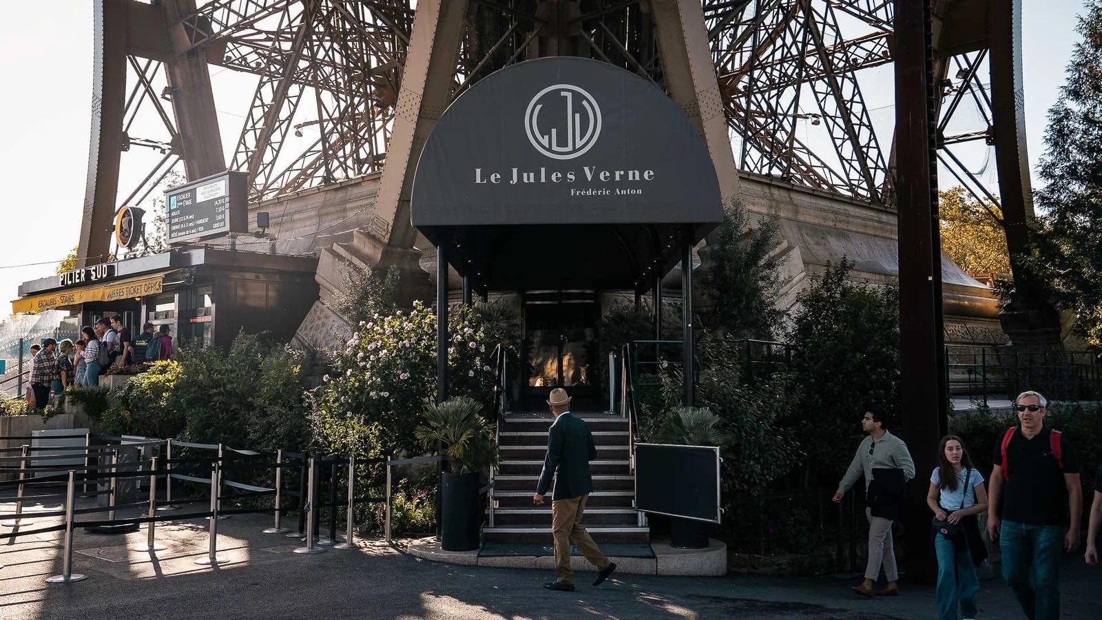 The entrance to Le Jules Verne at the foot of a pillar of the Eiffel Tower.