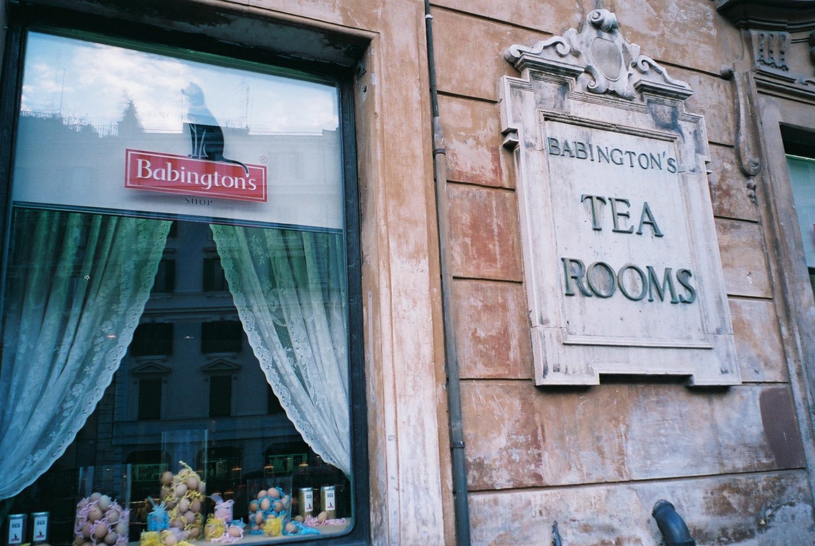 The marble sign of Babington's Tea Rooms beside its window on Piazza di Spagna.