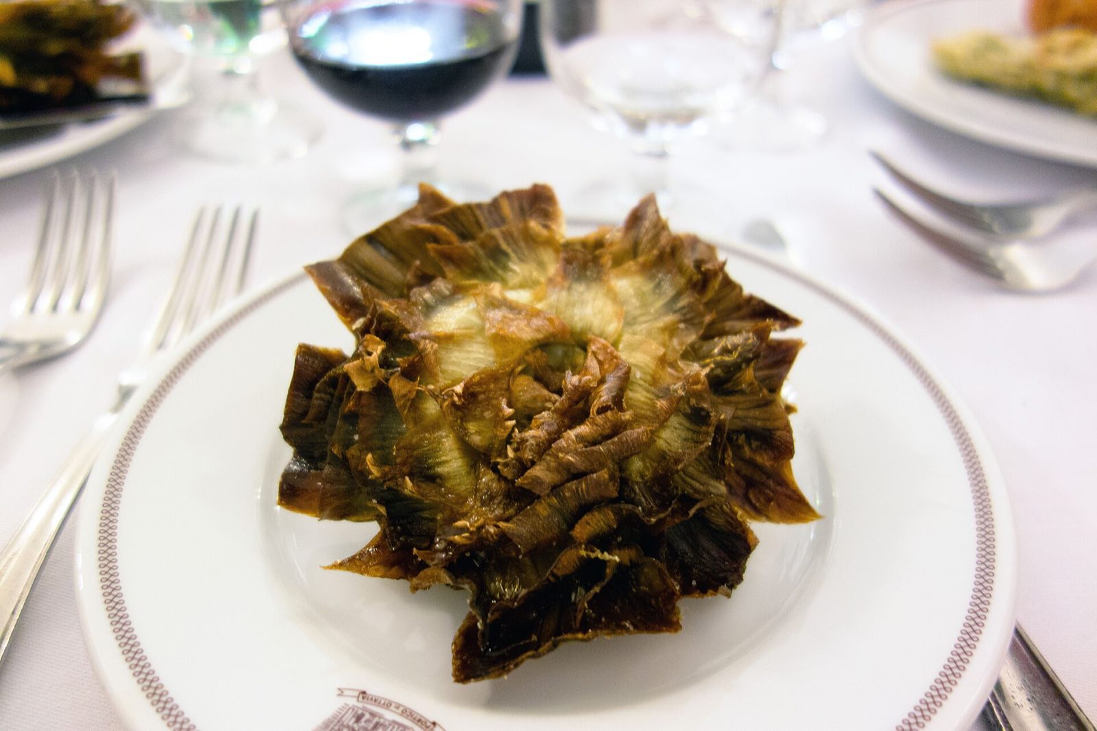 A carciofo alla giudia, a whole artichoke fried until its leaves open: the dish Piperno is known for. Not photographed at the restaurant.