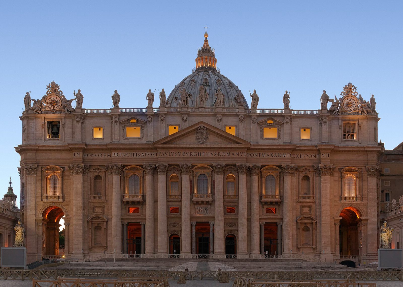 The front of St. Peter's Basilica at dusk.
