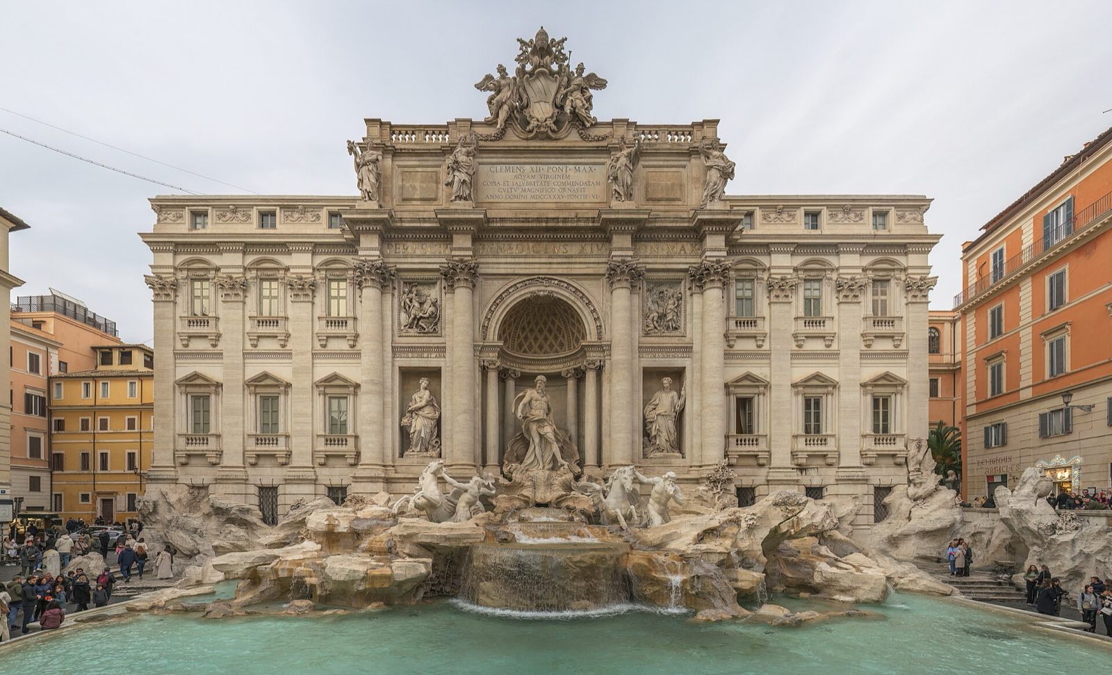 The Trevi Fountain, its statues above the water.