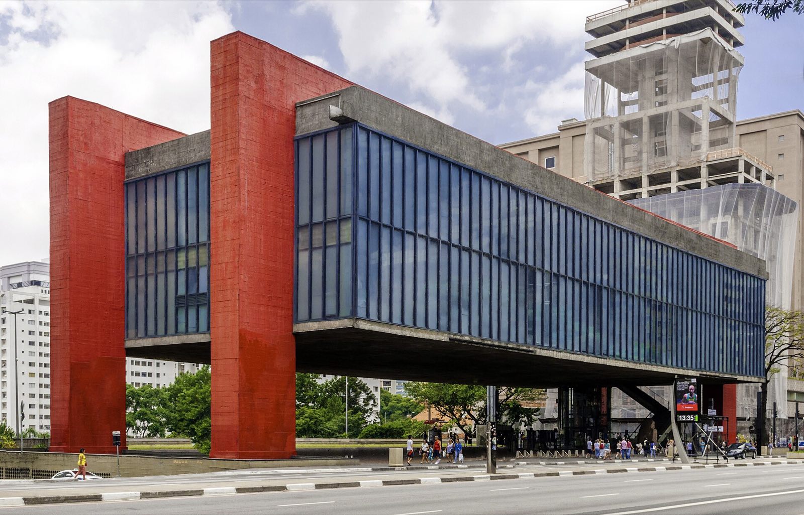 The Museu de Arte de São Paulo, a glass box hung between red concrete beams.