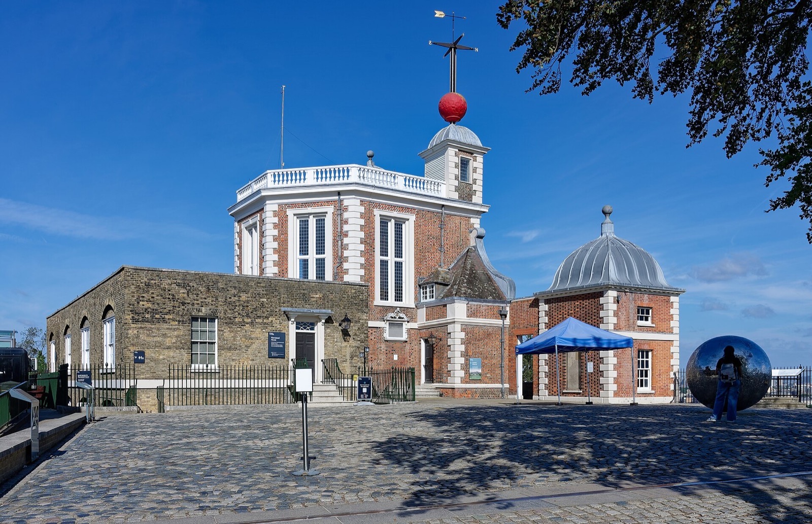Flamsteed House at the Royal Observatory, Greenwich, with the red time ball on its roof.