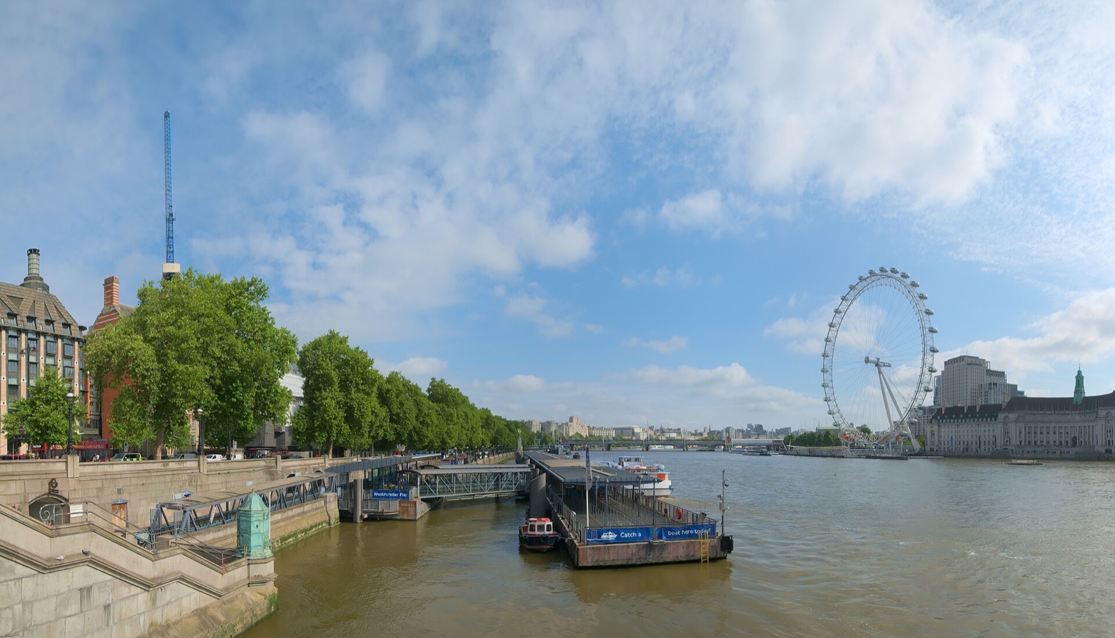 The London Eye and the Thames seen from Westminster Bridge, with County Hall beside the wheel.