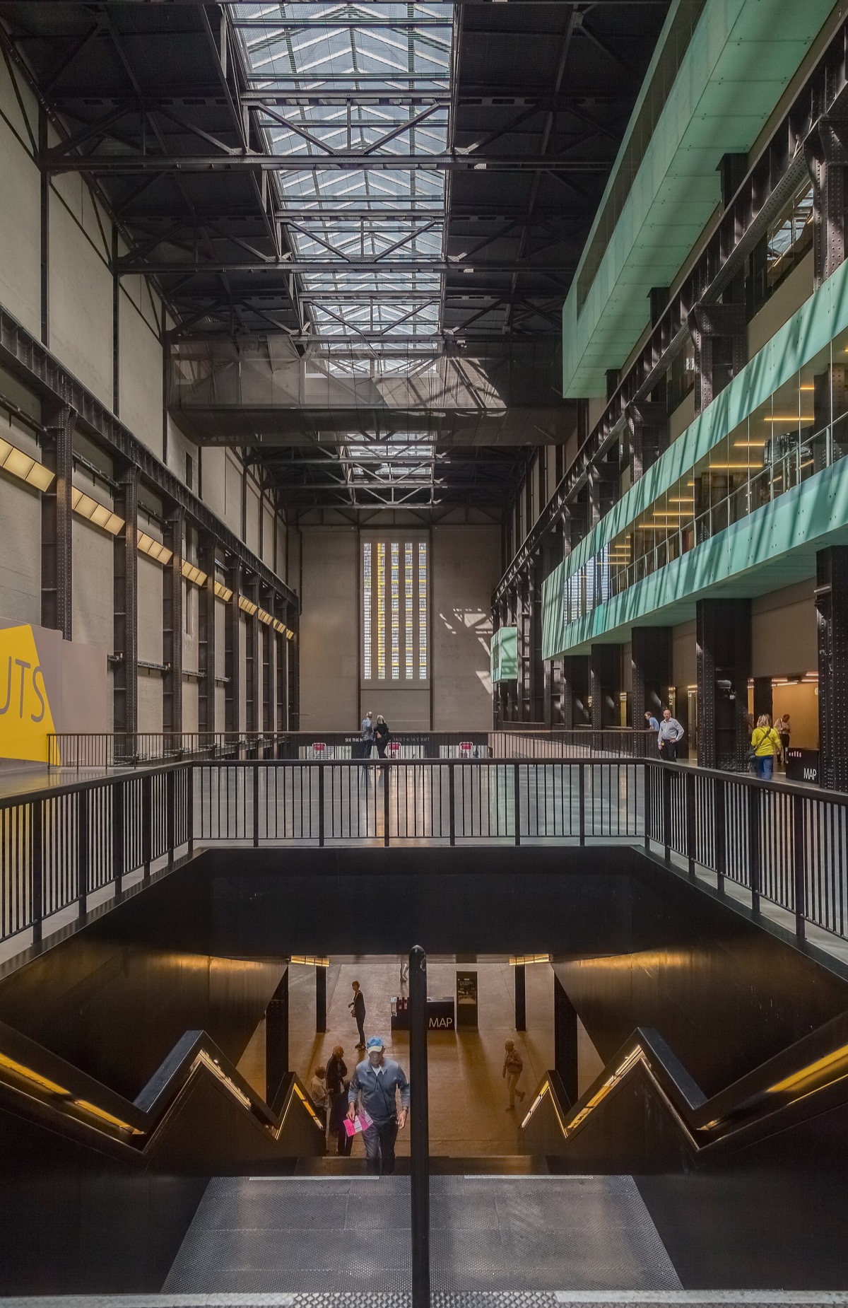 The Turbine Hall of Tate Modern, a vast empty space under steel beams and a strip of skylight.