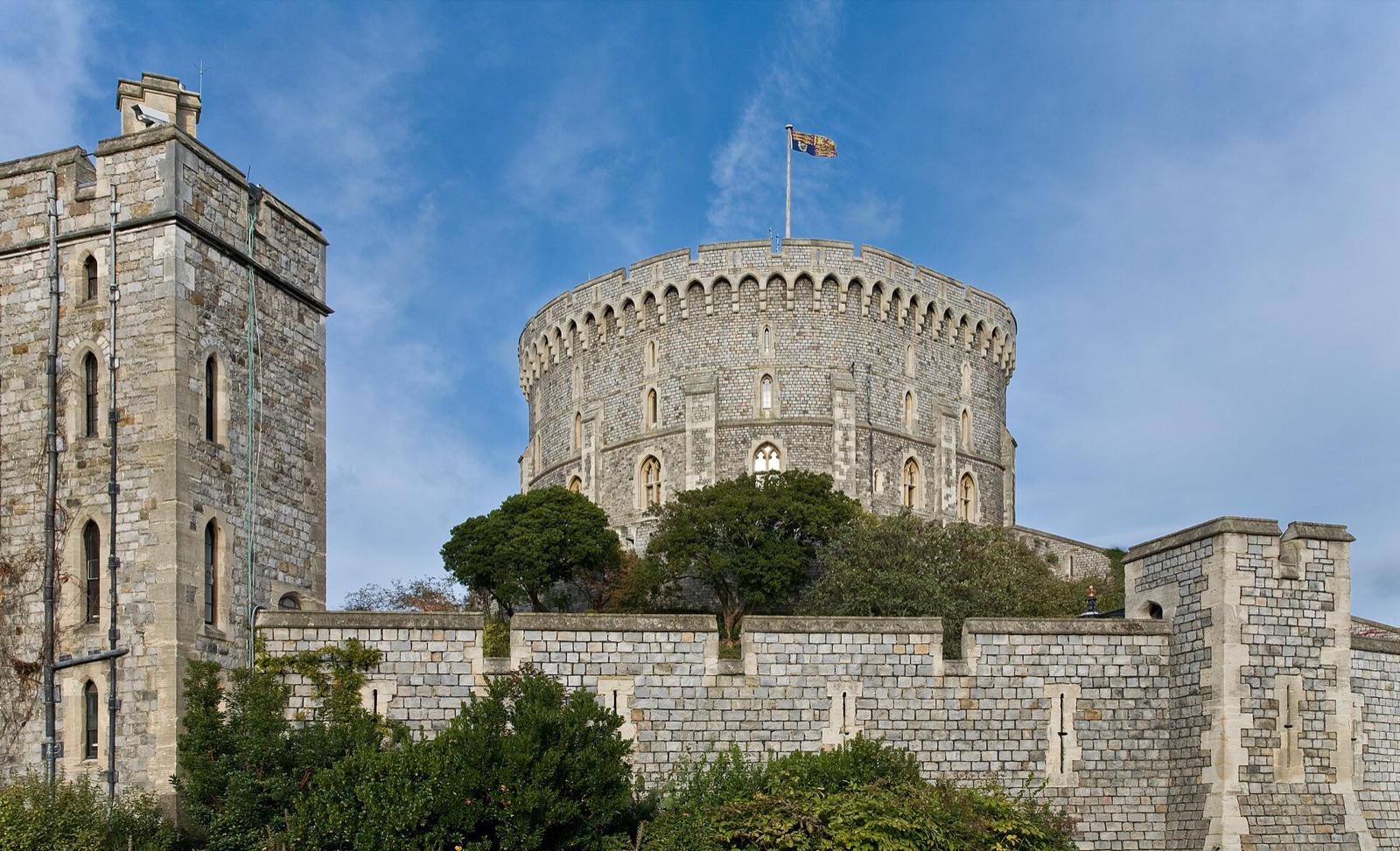 The Round Tower of Windsor Castle on its mound, with the royal flag flying.