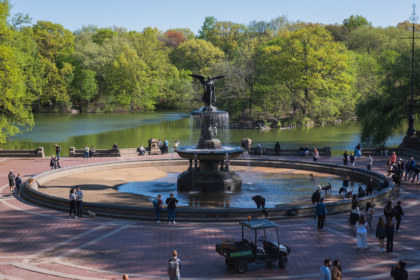 Bethesda Fountain and its terrace beside the Lake in Central Park, with people round the basin.
