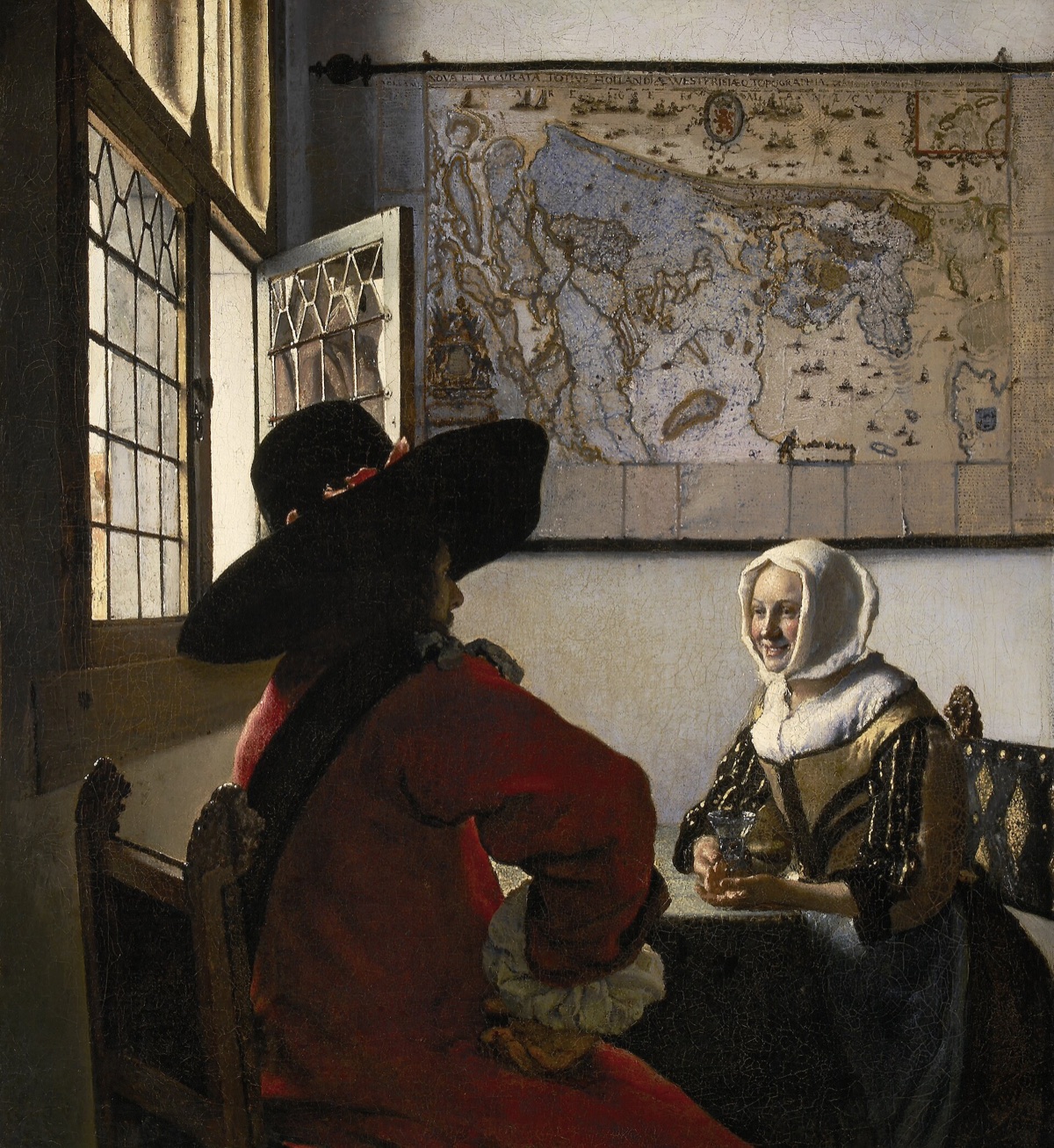 Officer and Laughing Girl by Johannes Vermeer: a soldier in a wide hat, seen from behind, and a smiling young woman at a table by a window.