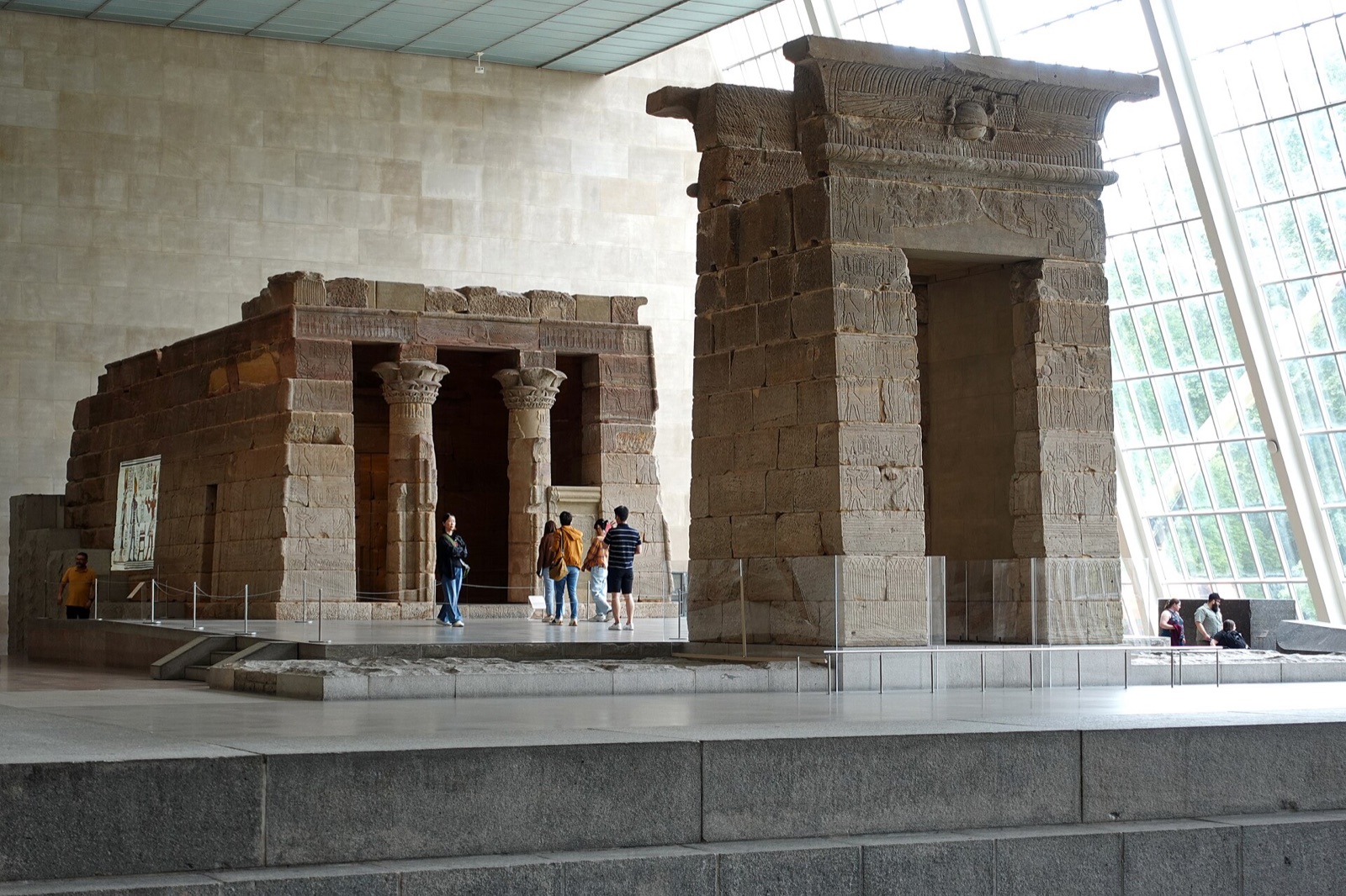 The Temple of Dendur, an Egyptian temple of sandstone, standing in its glass-walled hall at the Metropolitan Museum.