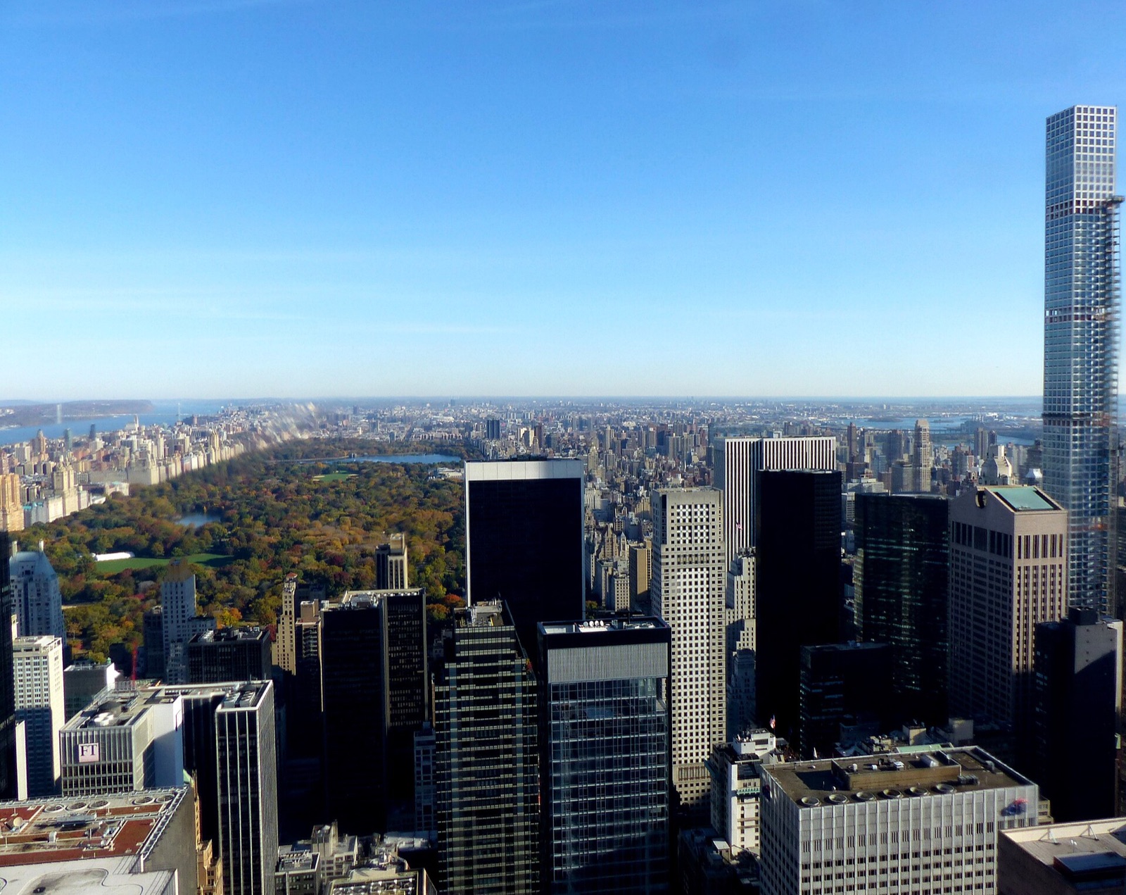 Central Park seen from Top of the Rock, a long rectangle of trees between the towers of Midtown.