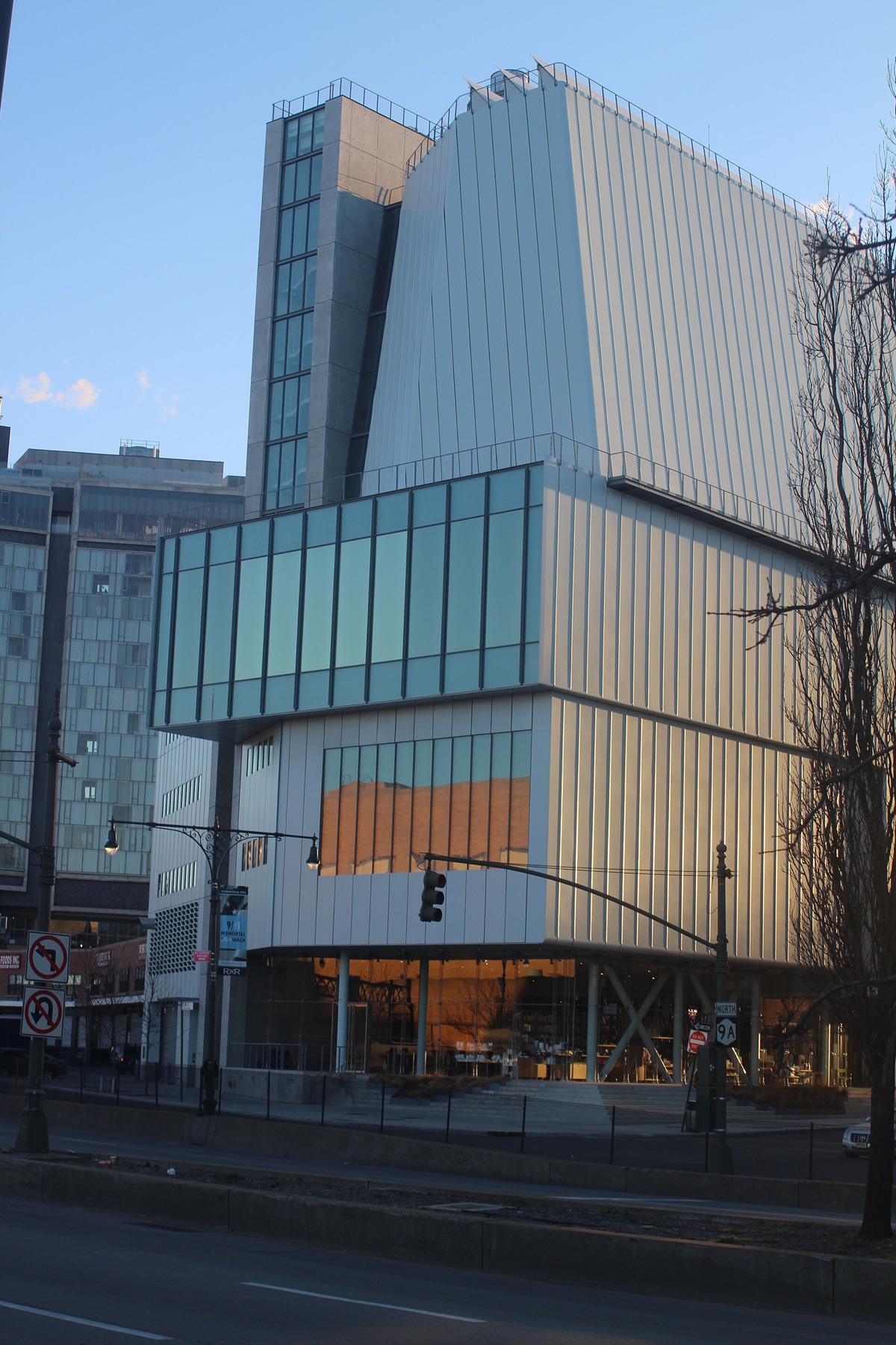 The Whitney Museum from the street, with its glass-walled ground floor under the overhang.