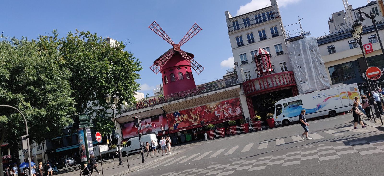 The Moulin Rouge by day, the red windmill above the entrance on the boulevard de Clichy.