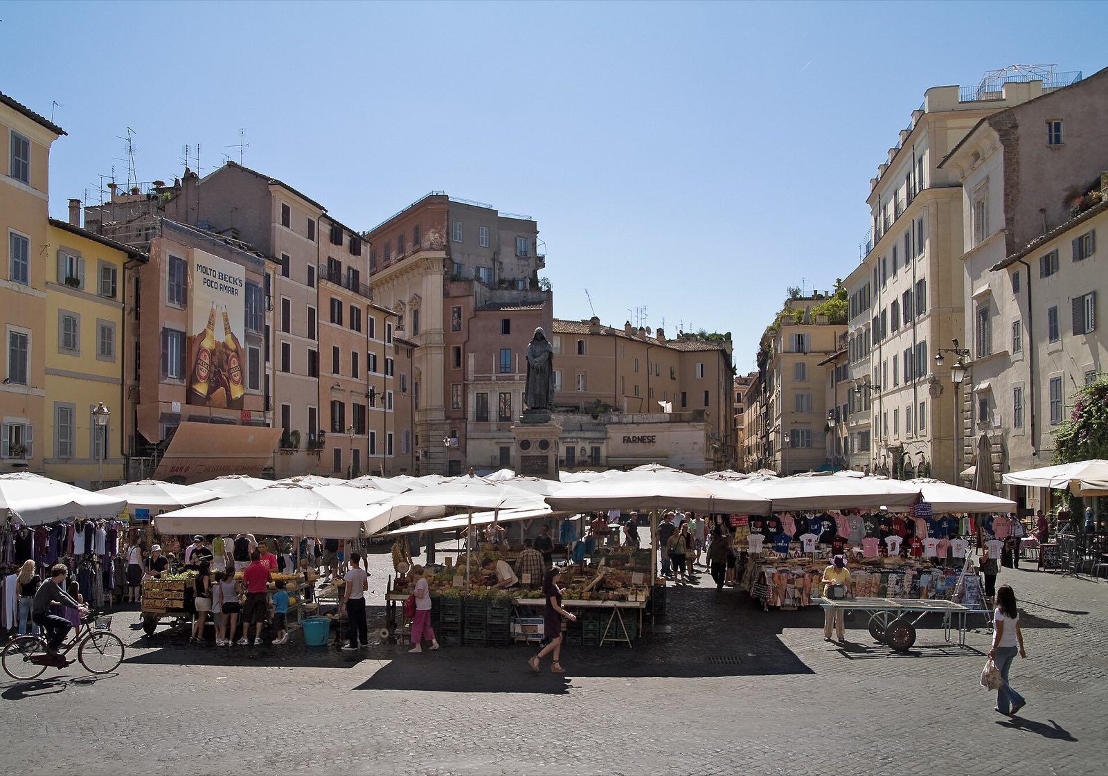 Campo de' Fiori with its market awnings, seen across the square.