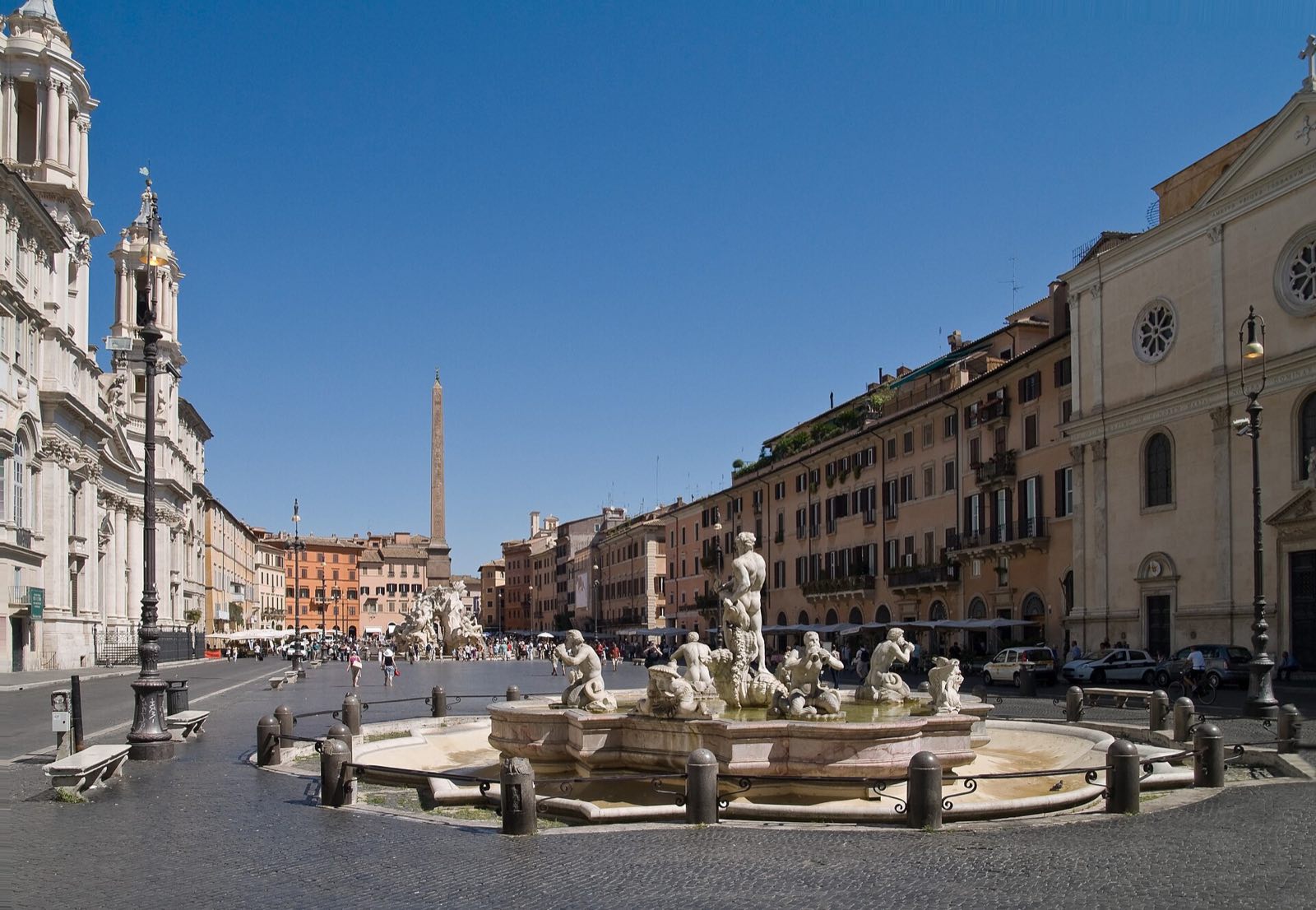 Piazza Navona seen from above, with the Fountain of the Moor in front and the long square behind it.