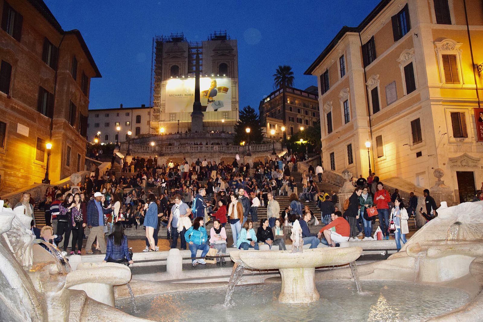 The Spanish Steps and the Barcaccia fountain at dusk, seen from Piazza di Spagna.