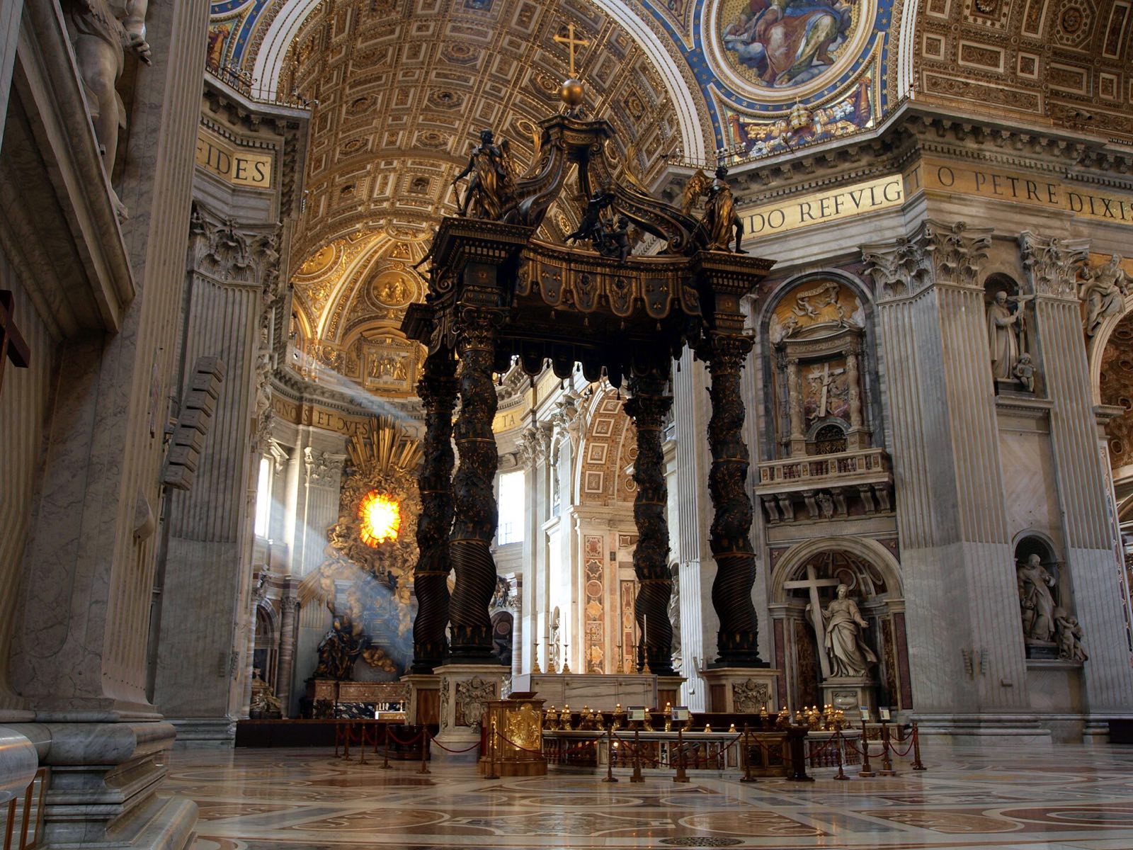 Bernini's bronze canopy on twisted columns over the high altar of St Peter's, under the dome.